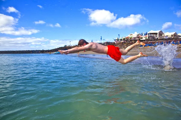Boy has fun in the clear sea — Stock Photo, Image