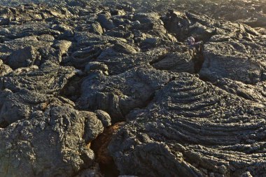 Stones of volcanic flow give a beautiful structure clipart