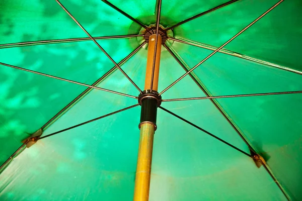 Open umbrella to protect against sun — Stock Photo, Image