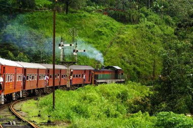 Riding by train the scenic mountain track from Nuwarelia to Colombo clipart
