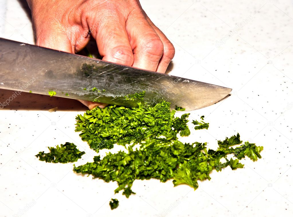 Cutting food with knife in the kitchen — Stock Photo © Hackman #5542922