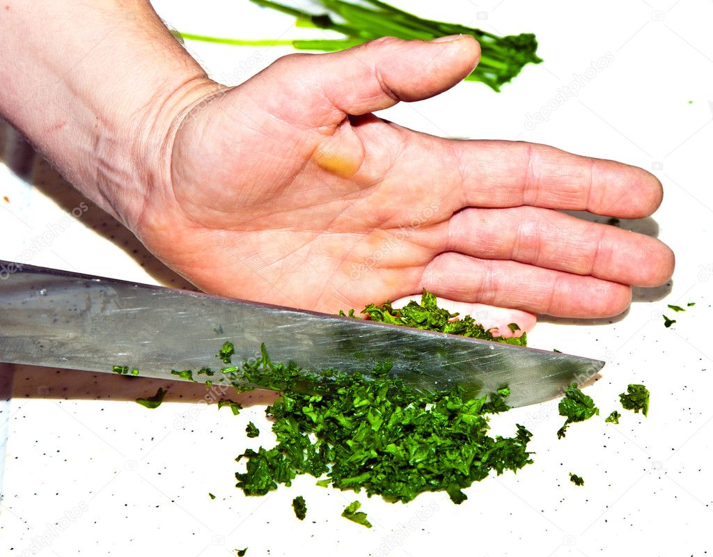 Cutting food with knife in the kitchen — Stock Photo © Hackman #5542925