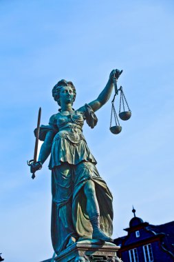 Statue of Lady Justice in front of the Romer in Frankfurt - Germ clipart