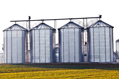 Silver silos in the field clipart