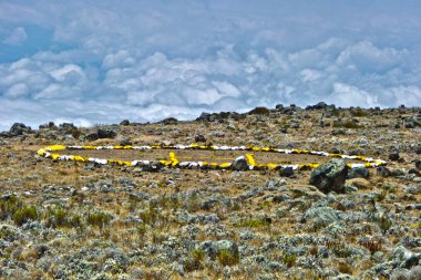 Camp with heli landing port at Mount Kilimanjaro trail in Afric clipart