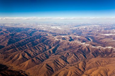 Beautiful view from the aircraft to the mountains of the Himalay clipart