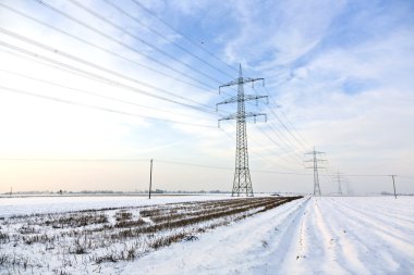 Electrical tower in wintertime clipart