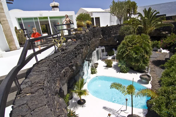 Swimming pool in natural volcanic rock area, Lanzarote, Spain — стоковое фото