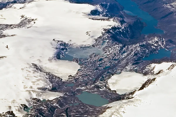 Birds view from the plane to the glaciers and mountains of the a — Stock Photo, Image