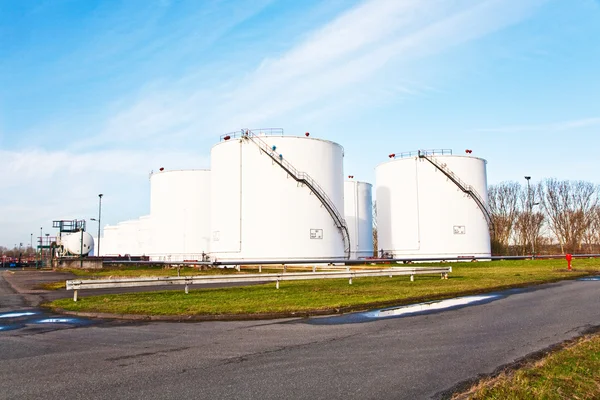 White tanks for petrol and oil in tank farm with blue sky — Stock Photo, Image