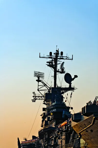 Aircraft carrier in sunset — Stock Photo, Image