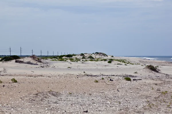 Vind former strukturer i sanddynerna på stranden — Stockfoto