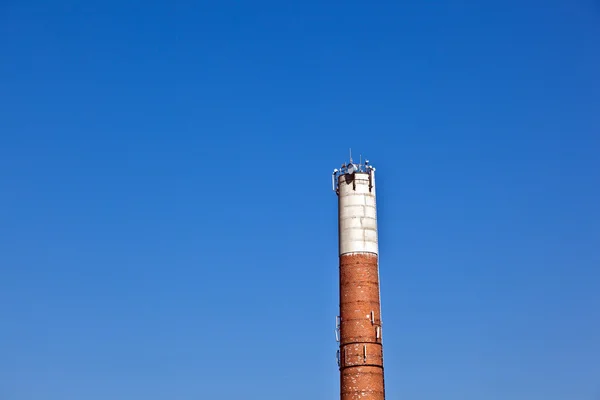Chimney of old abandoned industrial building — Stock Photo, Image