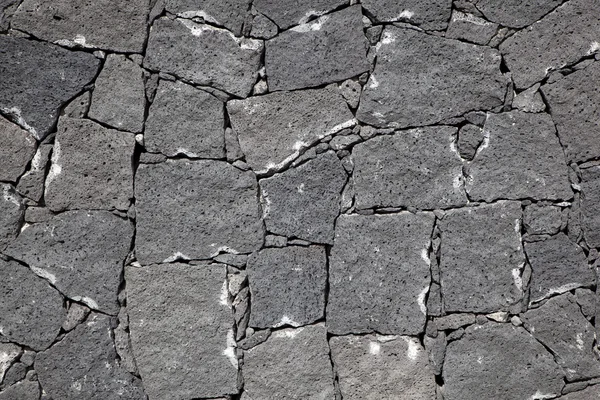 Varrat nélküli, vulkáni kőből készült tipikus fal — Stock Fotó