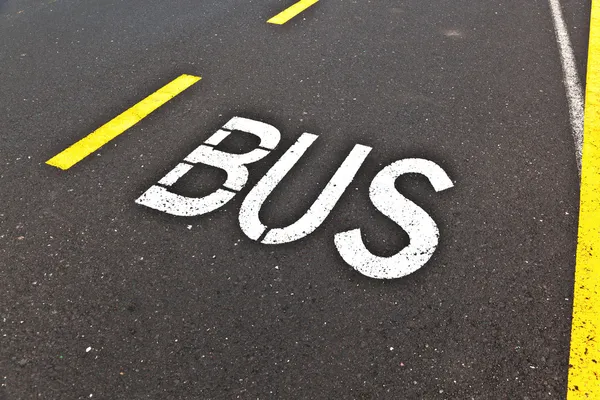 Signs for bus are painted on the street — Stock Photo, Image