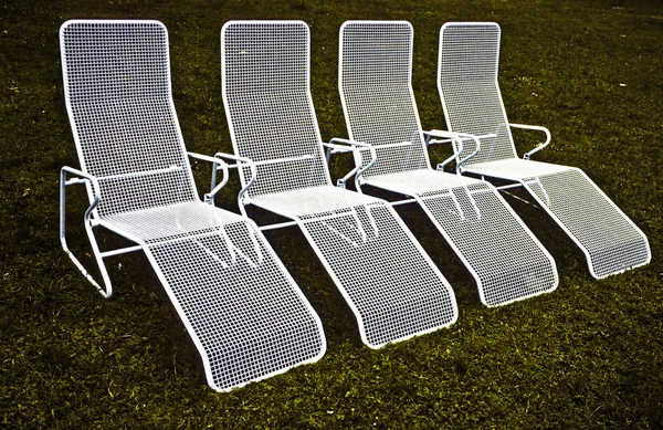 Cadeiras em fila harmônica — Fotografia de Stock