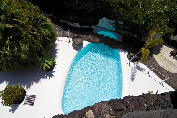 Swimming pool in natural volcanic rock area — Stock Photo, Image