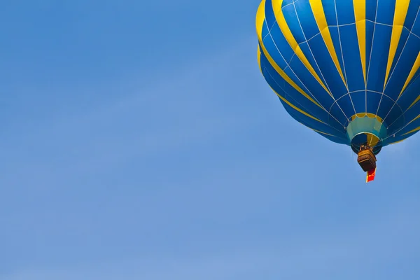 Hot Air Balloon in cloudy sky Stock Image