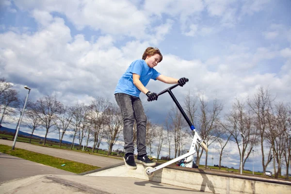 Boy with scooter — Stock Photo, Image