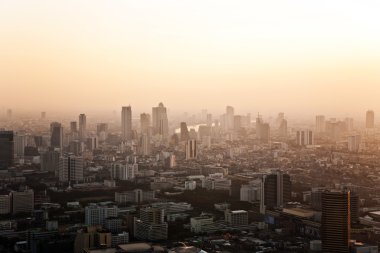 View across Bangkok skyline showing office blocks and condominiu clipart