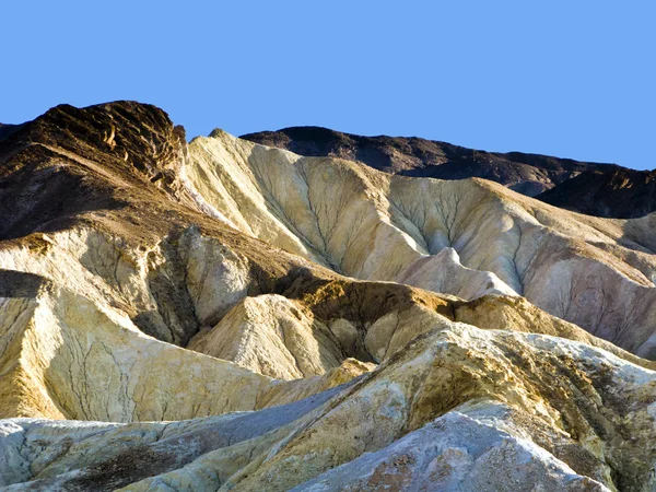 Pittoreska mjuka vågor från flerfärgade sandsten i död va — Stockfoto