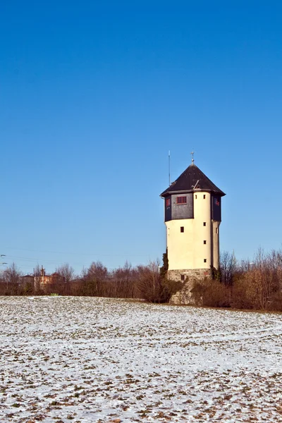 Water tower in beautiful landscape with blue sky — Stock Photo, Image