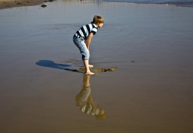 Boy at the beach in Venice clipart