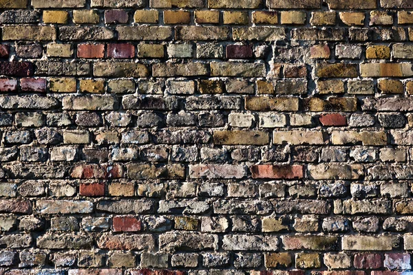 Red and yellow brick wall — Stock Photo, Image
