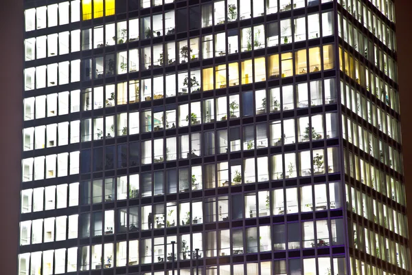 Facade of office building by night — Stock Photo, Image