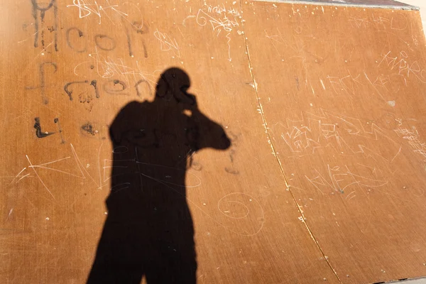 Σκιά του ένα fotographer στον σωλήνα ήμισυ — Φωτογραφία Αρχείου