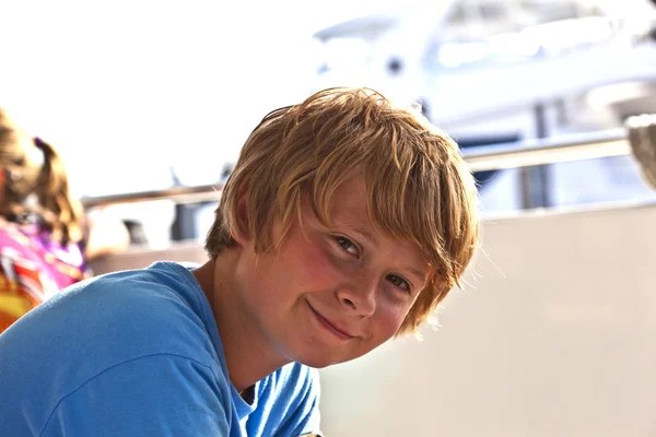 Young boy smiles and looks confident — Stock Photo, Image