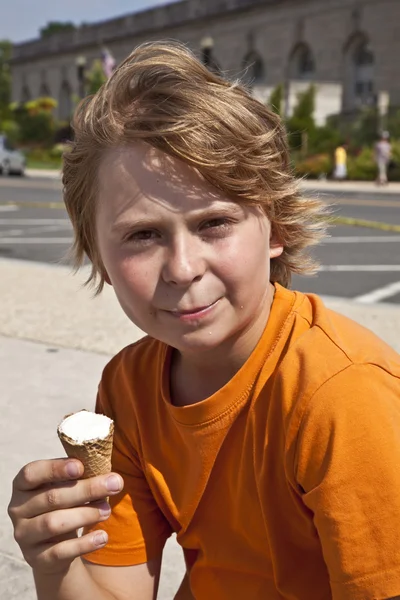Boy enjoys ice cream Royalty Free Stock Images
