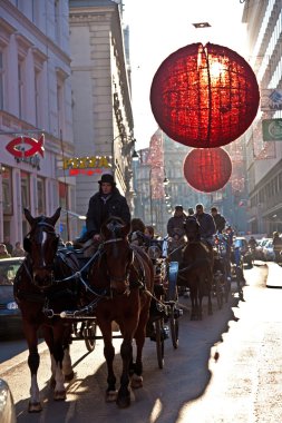 Streets are decorated with red christmas bauble ornaments clipart