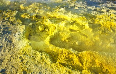 Yellow sulphur at the volcano on the island volcano in Italy clipart