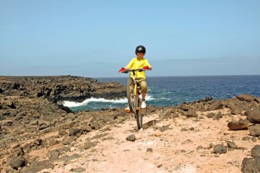 Young boy with mountain bike on tour clipart