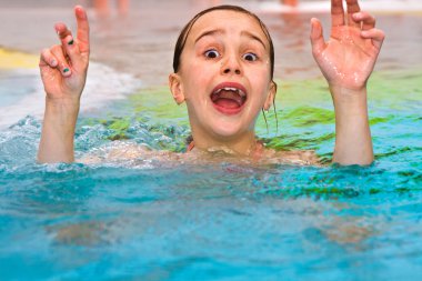 Children having fun in the outdoor thermal pool clipart