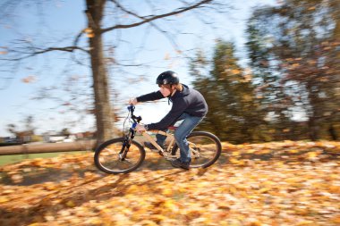 Young boy with mountain bike on tour clipart