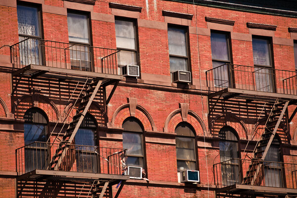 Fire ladder at old houses downtown in New York