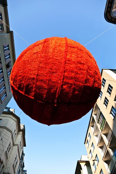 Streets are decorated with red christmas bauble ornaments — Stock Photo, Image