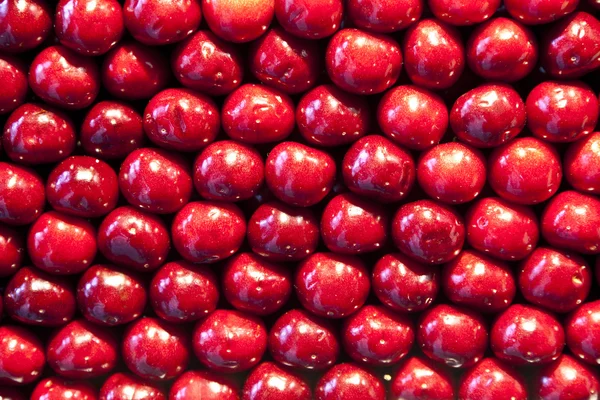 stock image Fresh cherries are stapled in pattern