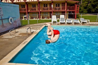 Child has fun in the pool clipart