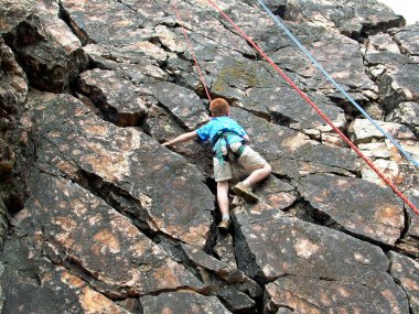 Boy climbing on rope clipart