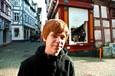 Cute boy likes to visit the old city clipart