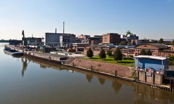 Old industrial building at the river — Stock Photo, Image