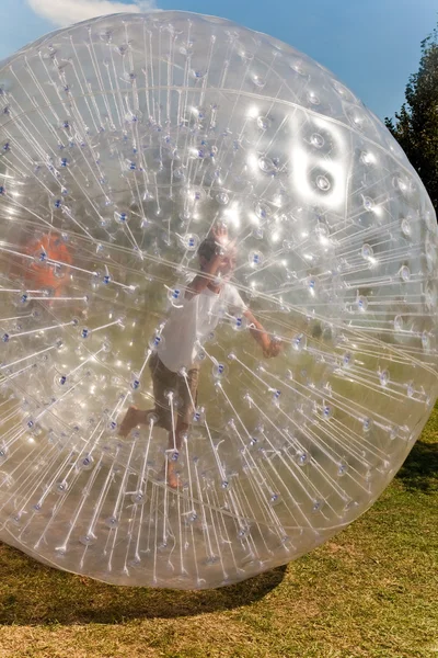 Cute child has a lot of fun in the Zorbing Ball — Stock Photo, Image