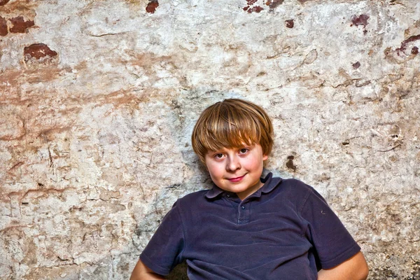 Boy in the cellar with a spotlight — Stock Photo, Image