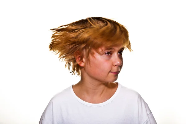 Boy is moving his head and hairs are flying — Stock Photo, Image