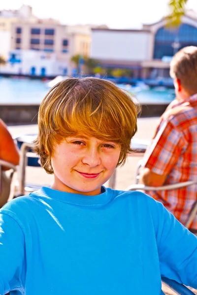 Outdoor portrait of relaxed cute young boy — Stock Photo, Image