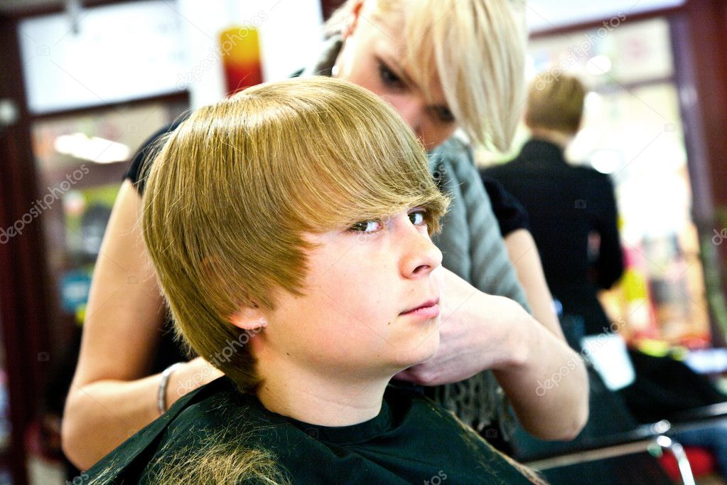 Smiling young boy at the hairdresser