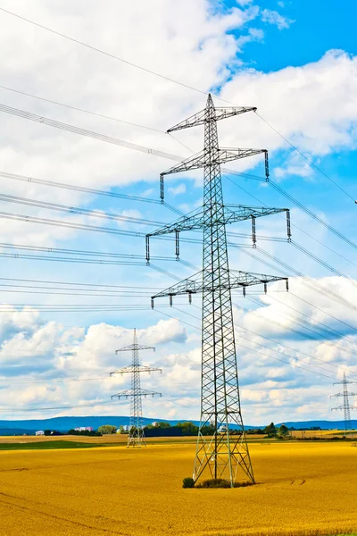 Electricity tower in field — Stock Photo, Image